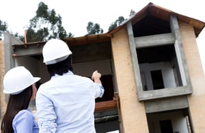 Two people planning renovations on their new home