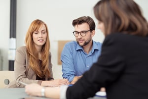 Landlord walking new tenants through terms to make sure they are good tenants