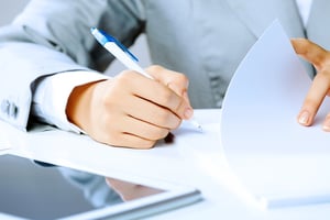 Man signing the paperwork to form a LLC