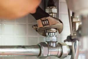 Plumber repairing pips in an older home